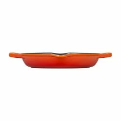 Le Creuset 9.75" Deep Round Signature Grill Pan | Flame Orange 7 Le Creuset 9.75" Deep Round Signature Grill Pan | Flame Orange -Le Creuset Shop flame orange deep grill pan side view