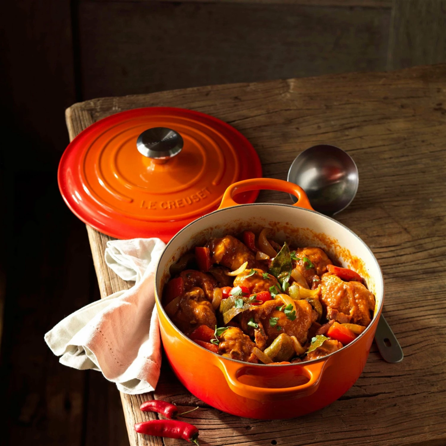 Le Creuset 4.5 Qt. Round Signature Dutch Oven With Stainless Steel Knob | Flame Orange 7 Le Creuset 4.5 Qt. Round Signature Dutch Oven With Stainless Steel Knob | Flame Orange - Image 5