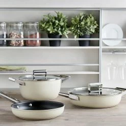 SMEG 4 Qt. Nonstick Deep Pan With Lid | Cream -Le Creuset Shop smeg cookware cream 1